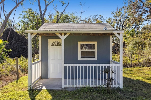 view of outdoor structure with a lawn