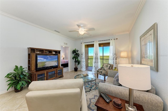 living room featuring ceiling fan, light tile patterned flooring, and crown molding