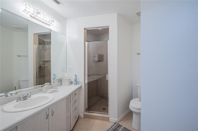 bathroom featuring toilet, tile patterned flooring, a textured ceiling, and walk in shower