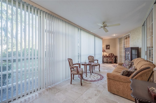 sunroom with ceiling fan