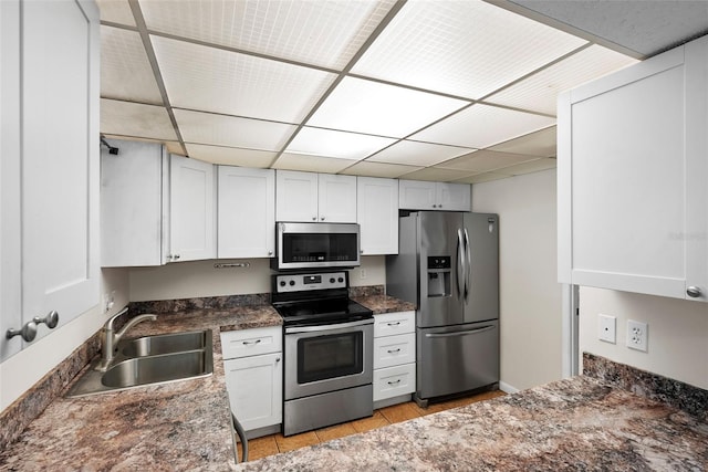 kitchen with white cabinets, sink, and appliances with stainless steel finishes