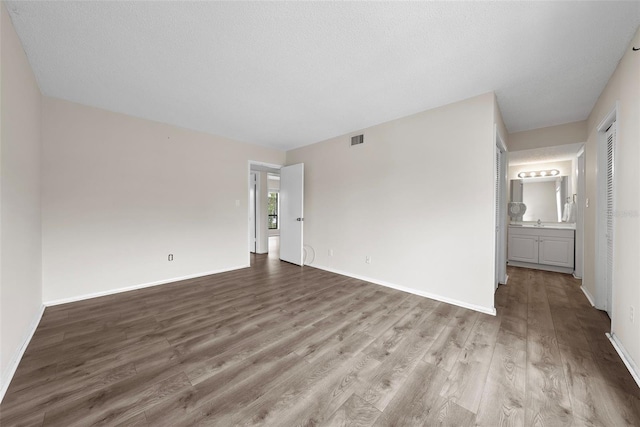 spare room featuring hardwood / wood-style flooring