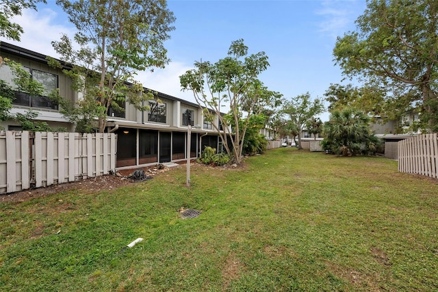 view of yard featuring a sunroom