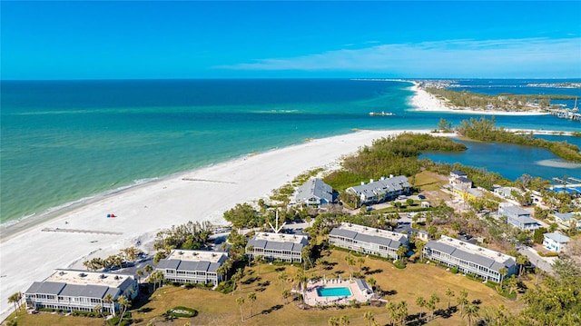 drone / aerial view featuring a view of the beach and a water view