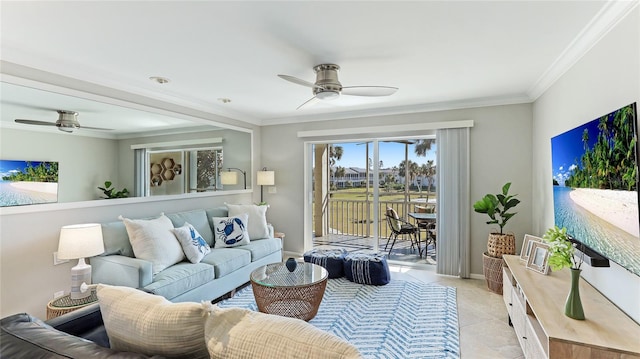 living area with baseboards, a ceiling fan, and crown molding