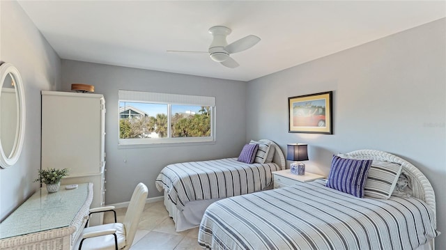 bedroom featuring ceiling fan, baseboards, and light tile patterned floors