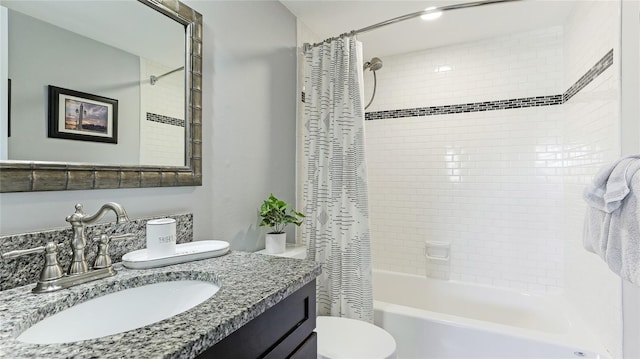 bathroom featuring vanity, toilet, and shower / tub combo with curtain