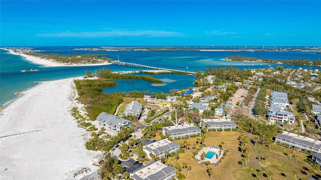 aerial view with a water view and a view of the beach