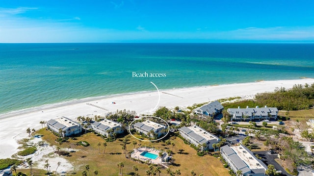 birds eye view of property featuring a water view and a view of the beach