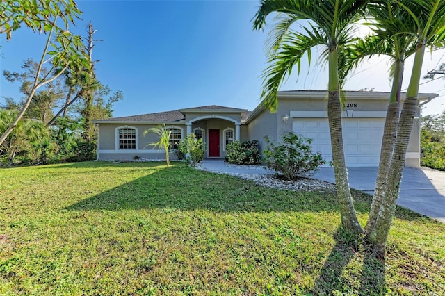 ranch-style home with a front yard and a garage