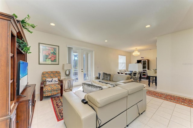 living area with light tile patterned floors, baseboards, french doors, and recessed lighting