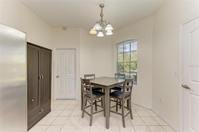 dining room featuring baseboards, light tile patterned flooring, and a notable chandelier