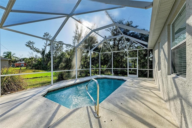 pool with a lanai and a patio