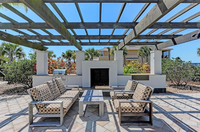 view of patio featuring an outdoor living space, a pergola, an outdoor kitchen, and grilling area