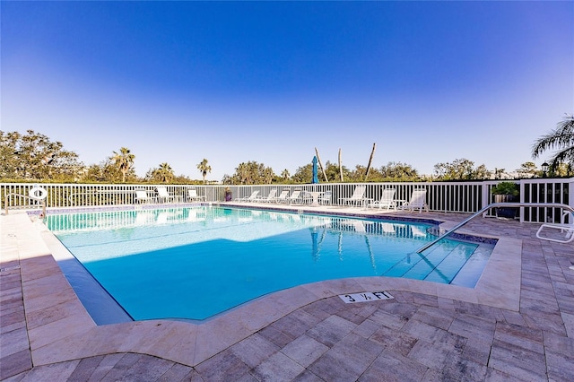 view of swimming pool with a patio area