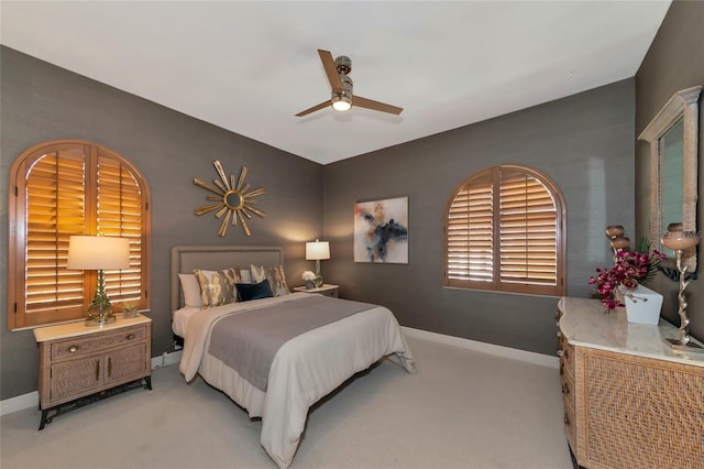 bedroom with light carpet and ceiling fan