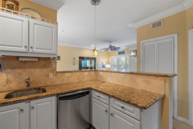 kitchen with ceiling fan, sink, dishwasher, white cabinetry, and hanging light fixtures