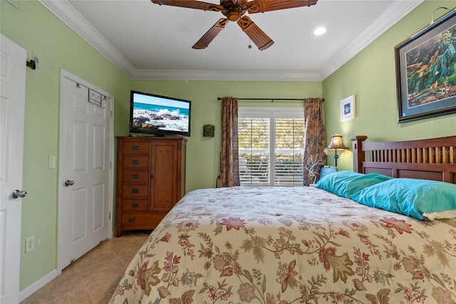 tiled bedroom with ceiling fan and ornamental molding