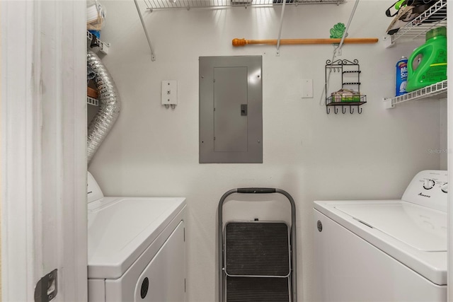 clothes washing area with independent washer and dryer and electric panel