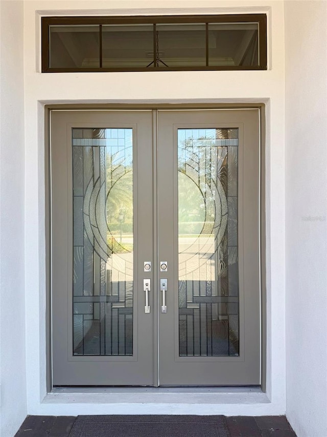 5305 Brookgrove Dr, Sarasota, FL 34238 - doorway to property featuring stucco siding