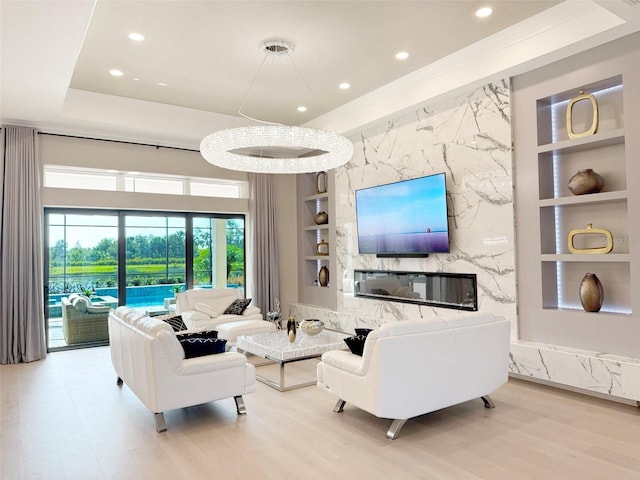 5305 Brookgrove Dr, Sarasota, FL 34238 - living area featuring recessed lighting, built in shelves, and wood finished floors