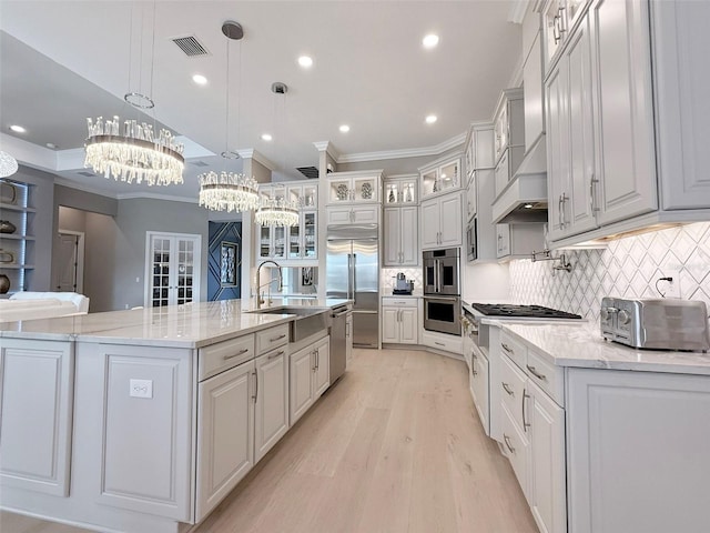 5305 Brookgrove Dr, Sarasota, FL 34238 - kitchen featuring visible vents, a toaster, appliances with stainless steel finishes, a notable chandelier, and a sink