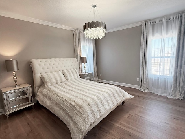5305 Brookgrove Dr, Sarasota, FL 34238 - bedroom with an inviting chandelier, baseboards, dark wood-type flooring, and ornamental molding