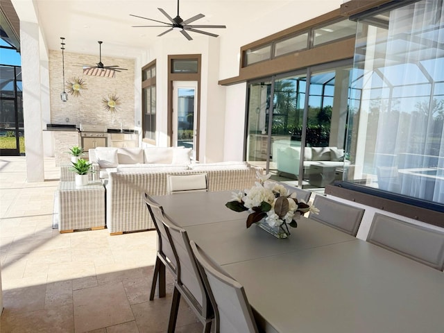 5305 Brookgrove Dr, Sarasota, FL 34238 - view of patio featuring area for grilling, ceiling fan, glass enclosure, outdoor lounge area, and an outdoor kitchen