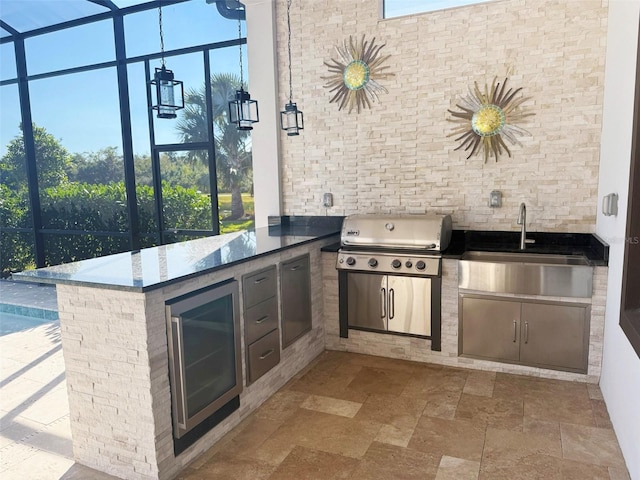 5305 Brookgrove Dr, Sarasota, FL 34238 - view of patio / terrace featuring beverage cooler, area for grilling, a sink, a lanai, and a grill