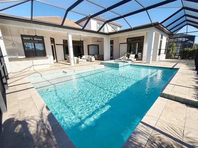 5305 Brookgrove Dr, Sarasota, FL 34238 - view of swimming pool with a pool with connected hot tub, a lanai, an outdoor hangout area, a patio, and a ceiling fan