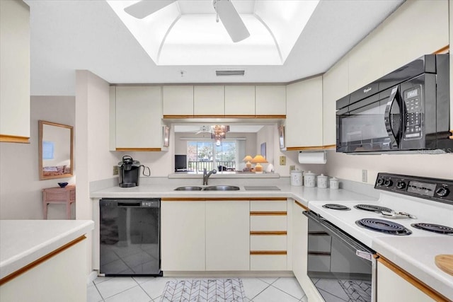 kitchen featuring black appliances, ceiling fan with notable chandelier, light tile patterned floors, and sink