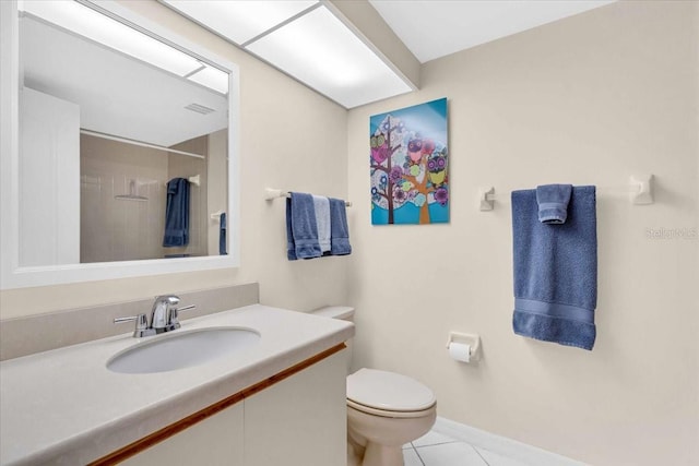 bathroom with tile patterned flooring, vanity, toilet, and walk in shower