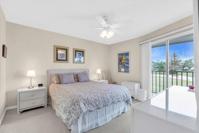 carpeted bedroom featuring access to outside and ceiling fan