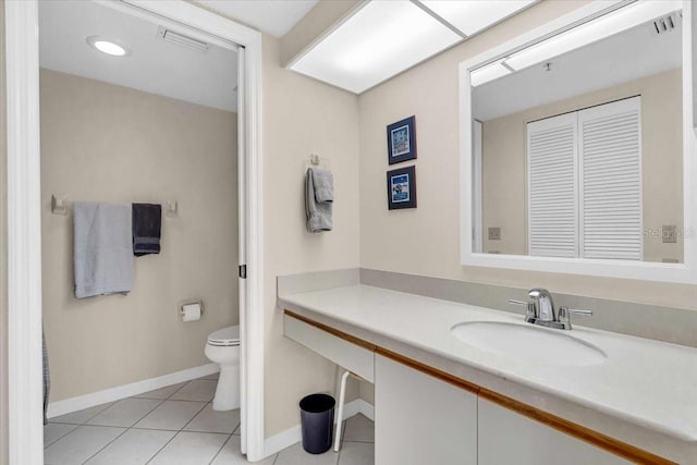 bathroom with tile patterned floors, vanity, and toilet