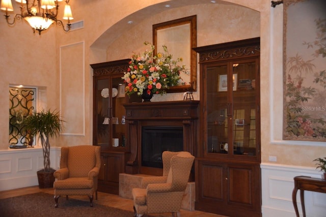 sitting room featuring a chandelier