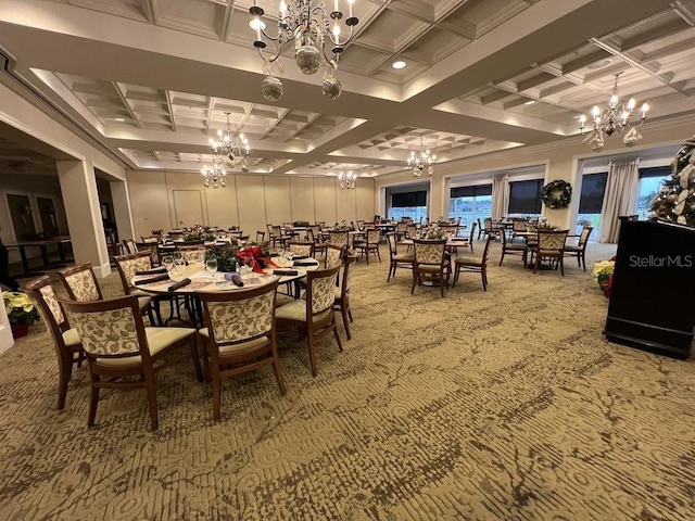 carpeted dining room with a chandelier and coffered ceiling