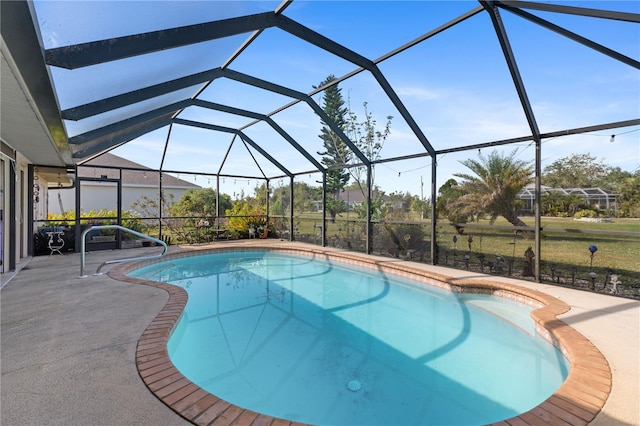 view of pool featuring a lanai and a patio area