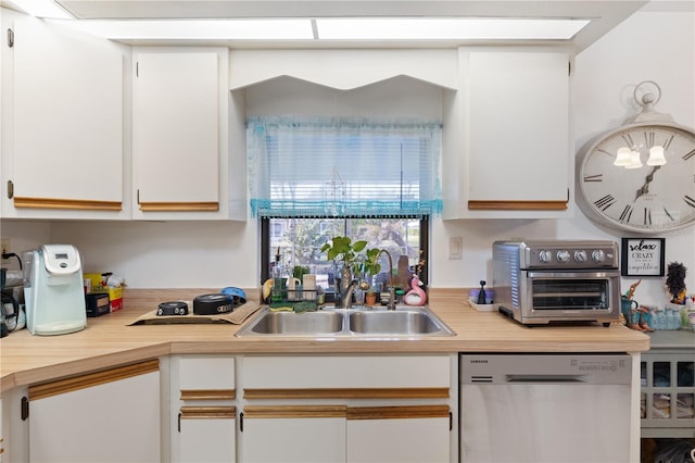 kitchen featuring white cabinetry and stainless steel dishwasher