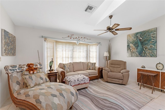 living room featuring ceiling fan and light tile patterned floors