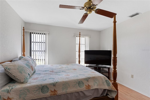 bedroom with ceiling fan and light hardwood / wood-style floors