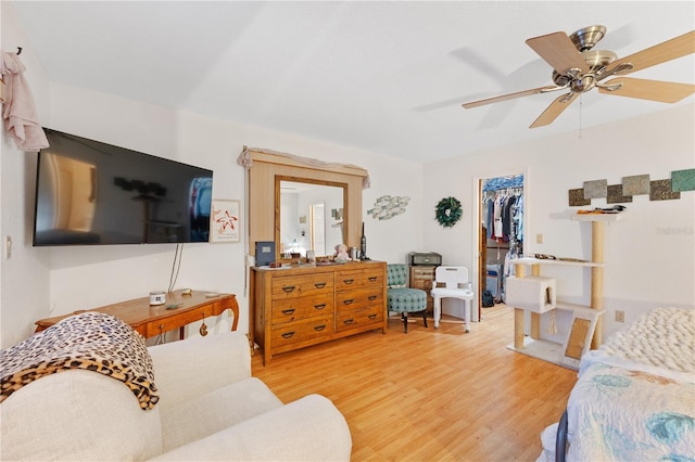 living room featuring hardwood / wood-style flooring and ceiling fan