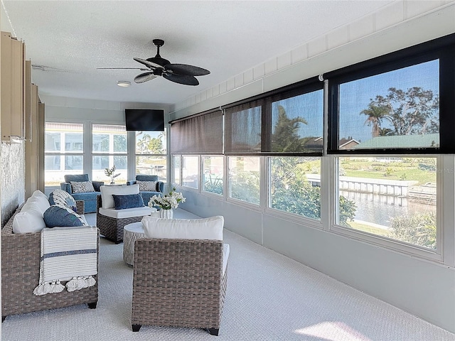 sunroom featuring plenty of natural light and ceiling fan