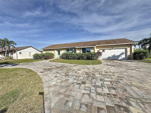 ranch-style home with a front lawn and a garage