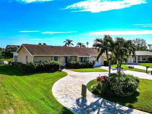 single story home with a front lawn