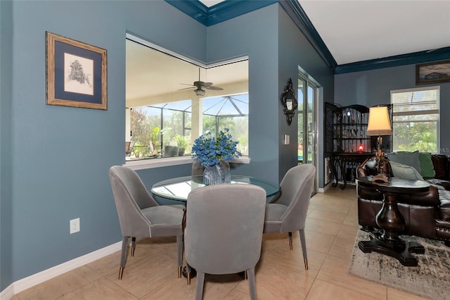 dining space with light tile patterned floors, a wealth of natural light, crown molding, and ceiling fan