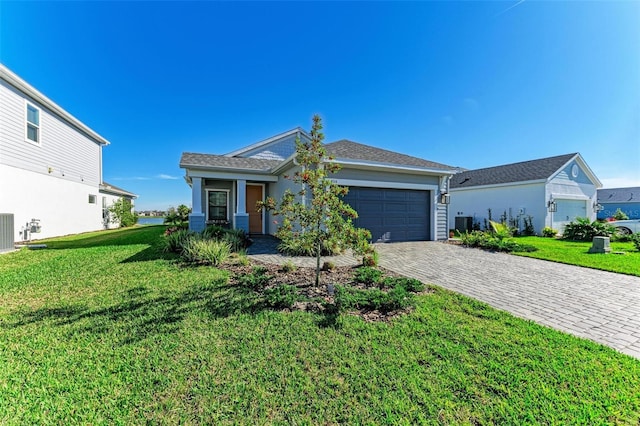 ranch-style house with a garage and a front lawn