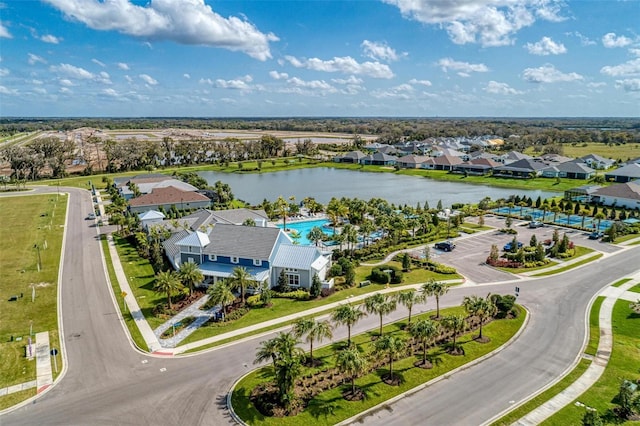 birds eye view of property with a water view