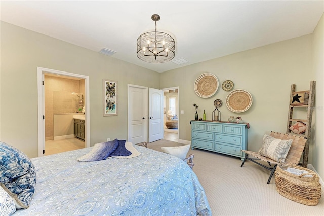 carpeted bedroom featuring connected bathroom and an inviting chandelier