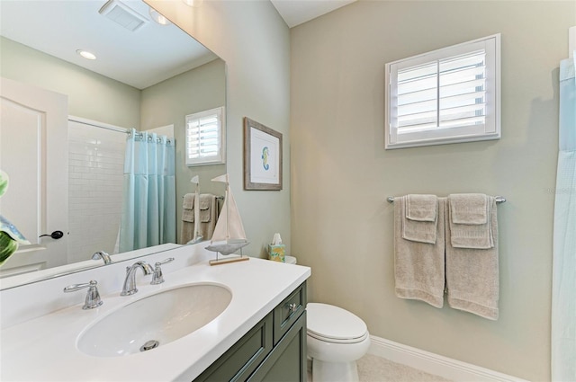 bathroom with vanity, a shower with curtain, and toilet