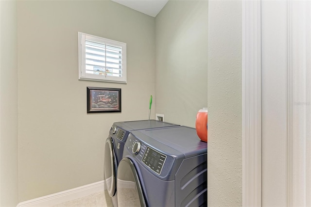 clothes washing area featuring independent washer and dryer